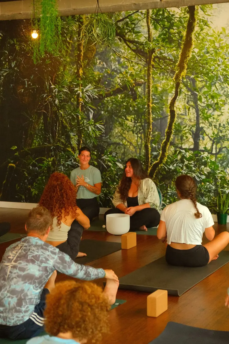 Yoga class practicing at Half Pigeon Yoga studio in St. Petersburg